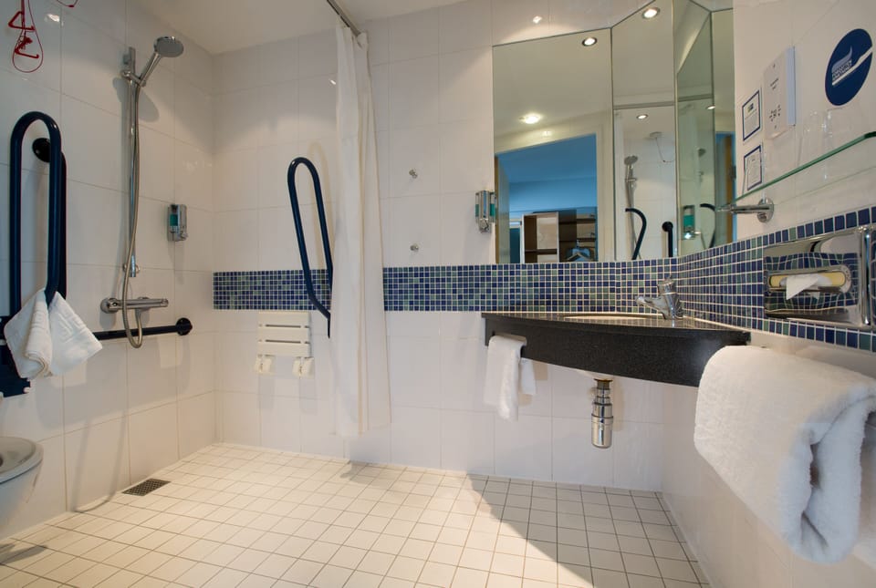 Shower, eco-friendly toiletries, hair dryer, towels