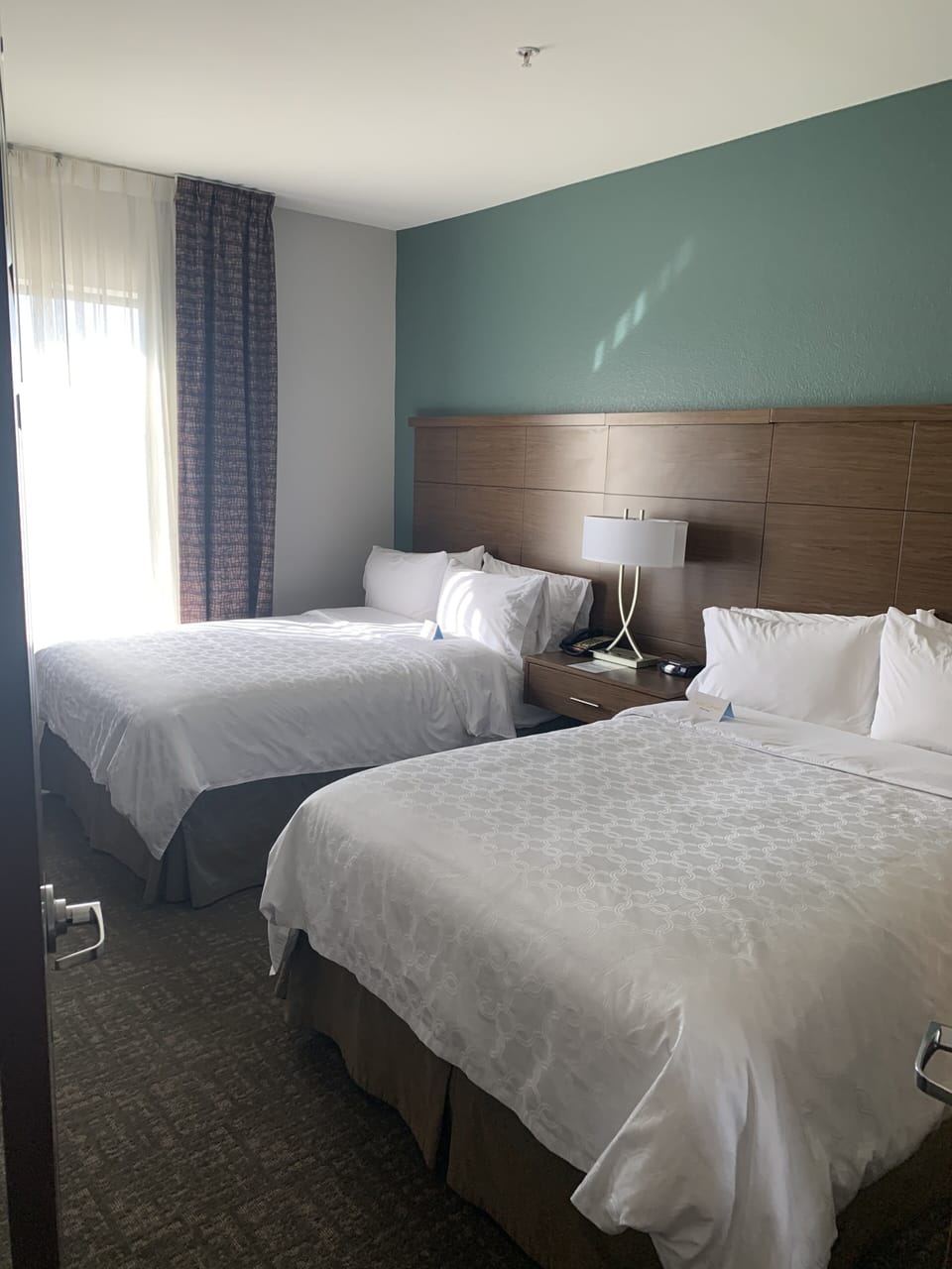 Desk, laptop workspace, blackout drapes, iron/ironing board