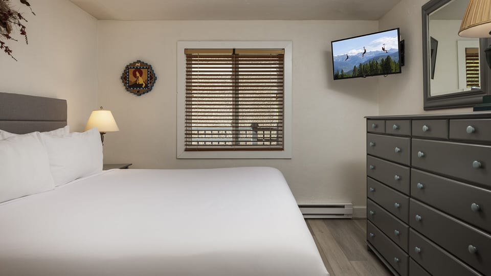 Sink into crisp white linens and let the day unwind. Your cozy retreat features thoughtful touches, ample storage, and a restful ambiance designed just for you.