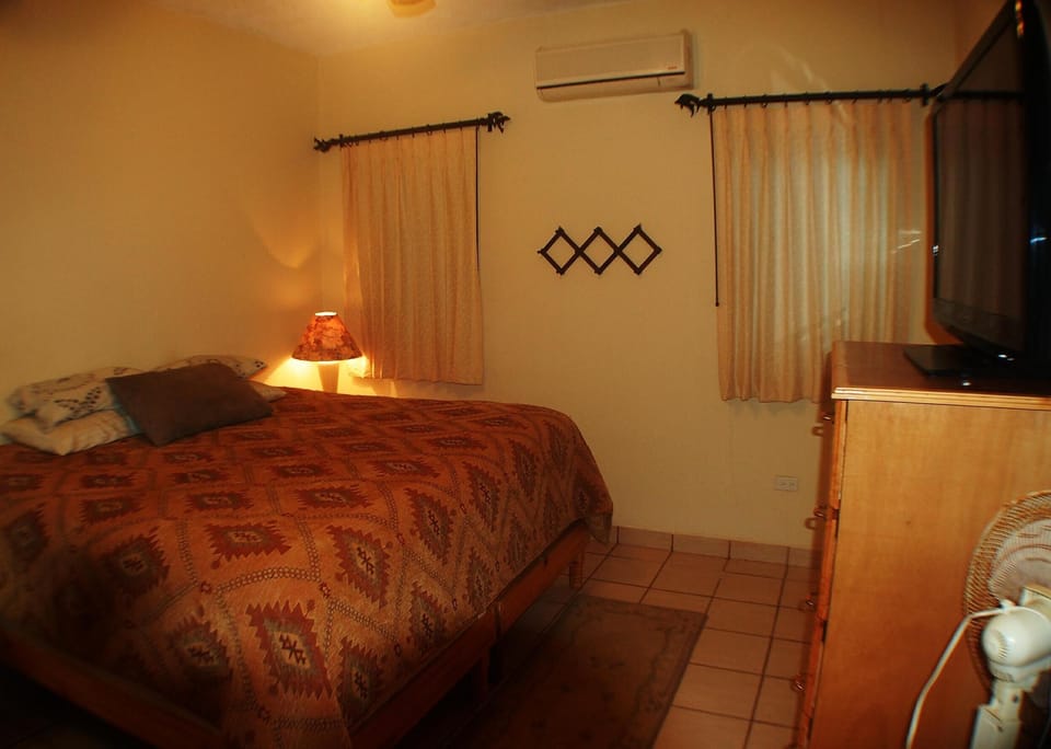 The bedroom is clean, spacious, and has a king size bed!