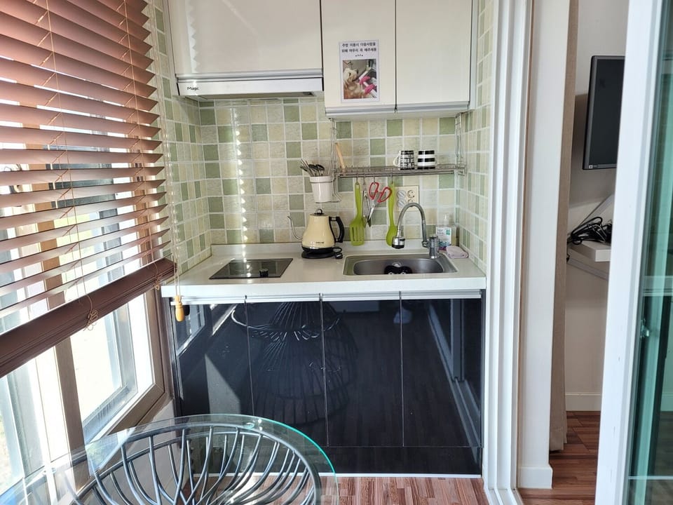 Double Room | Private kitchen | Full-size fridge, microwave, stovetop, rice cooker