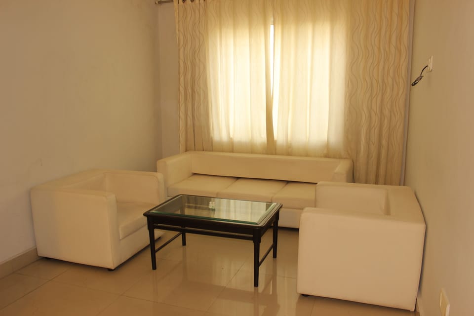Family Suite, 1 Bedroom | Living room | LCD TV, fireplace