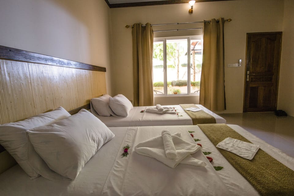 Deluxe Double or Twin Room, Balcony, Garden View | Minibar, in-room safe, soundproofing, iron/ironing board