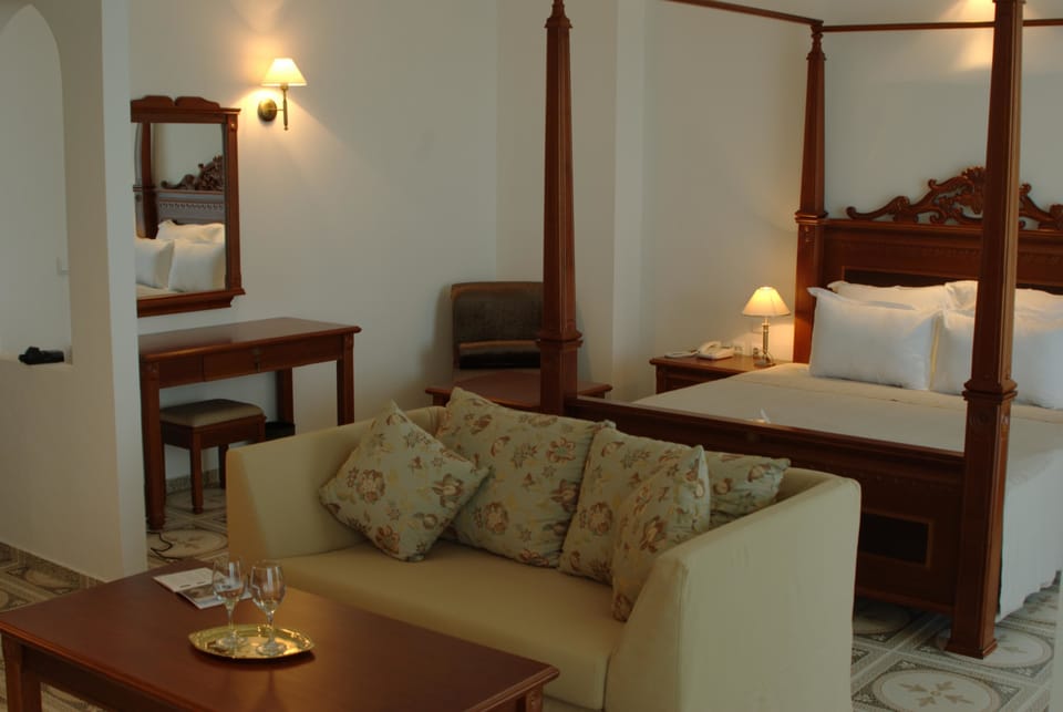 Superior Double Room | Living area | 30-cm flat-screen TV with satellite channels, TV
