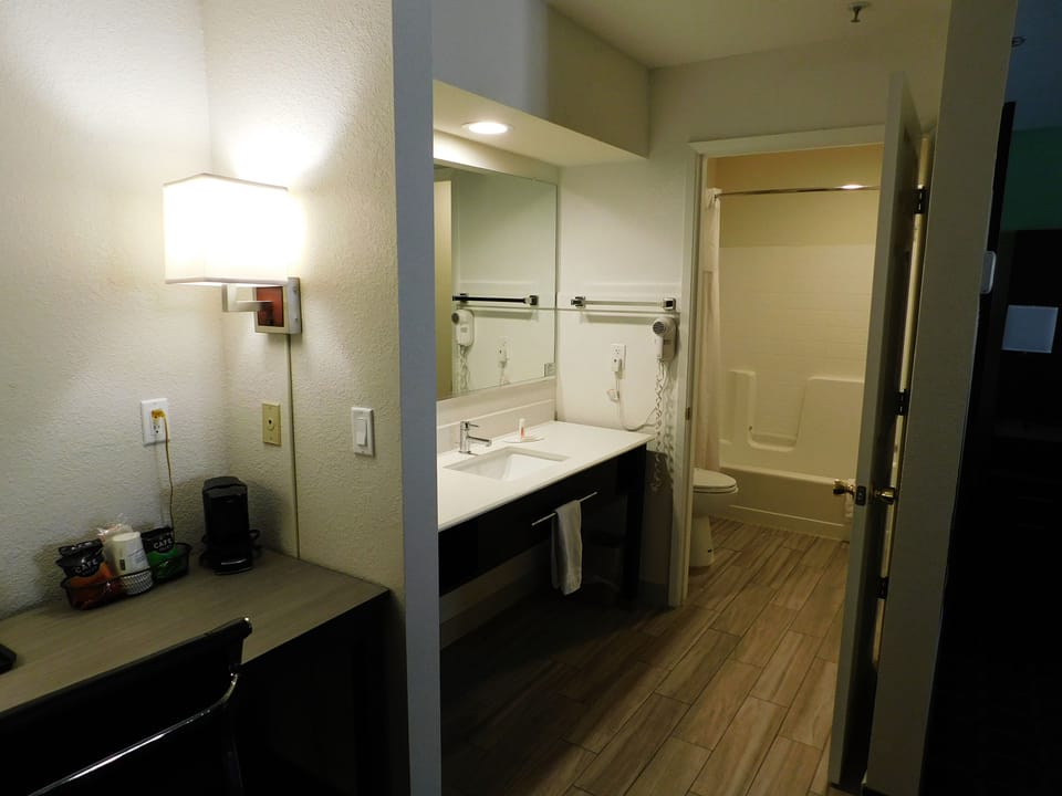 Studio Suite, 1 King Bed, Non Smoking | Bathroom | Combined shower/tub, free toiletries, hair dryer, towels