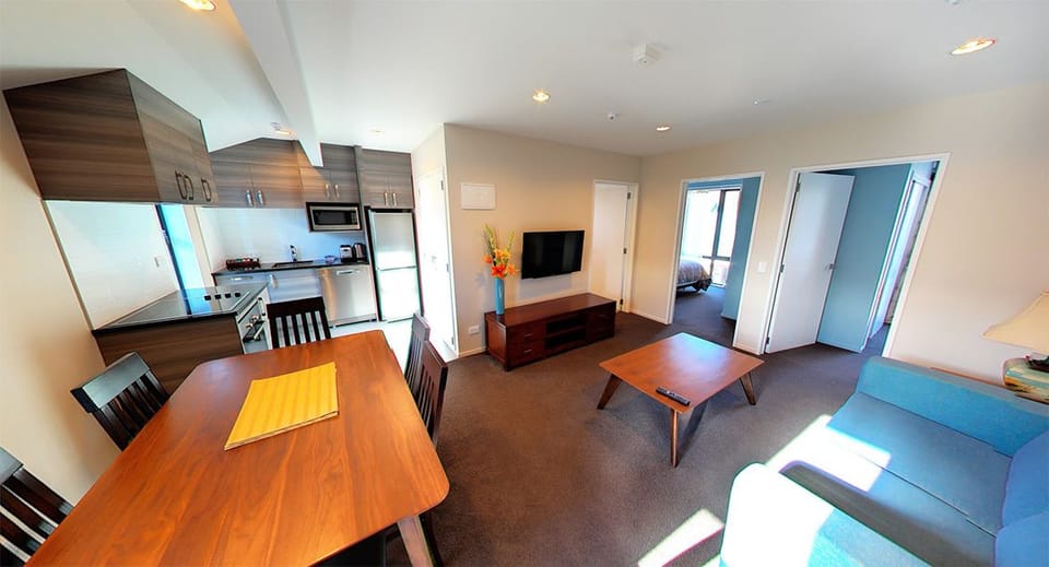 Deluxe Two Bedroom Apartment | Living area | Flat-screen TV, fireplace