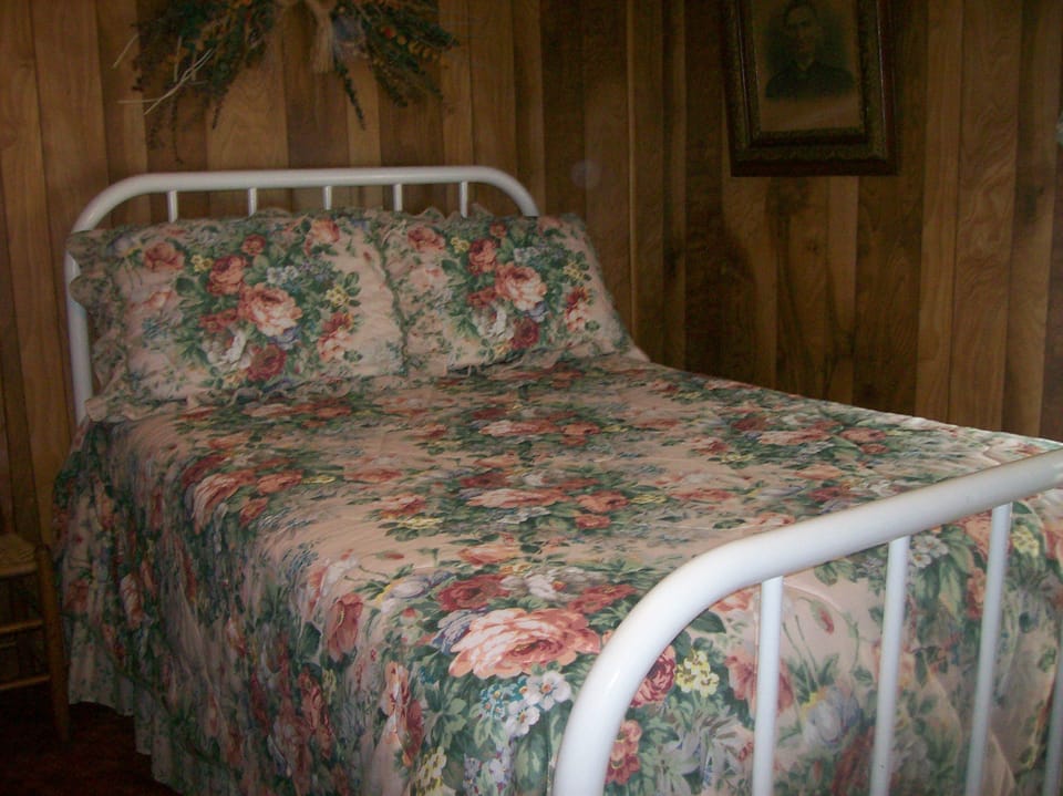 upstairs bedroom full size bed.