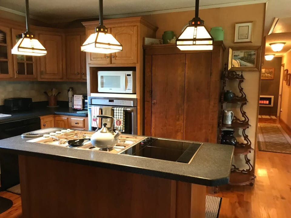 Cooktop, microwave, full Maytag oven, toaster, toaster oven, fully stocked