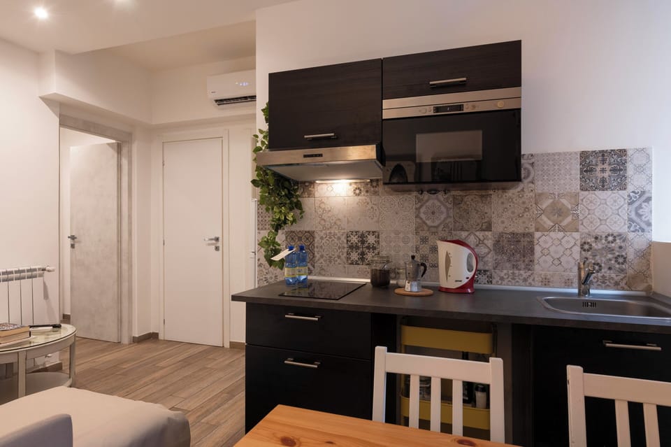 Basic Room, Ground Floor | Private kitchen | Microwave, eco-friendly cleaning products