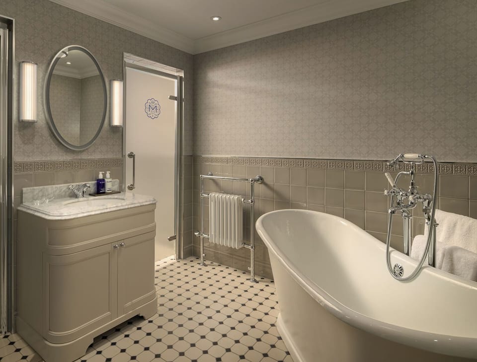 Luxury Suite, 1 King Bed, Garden View | Bathroom | Designer toiletries, hair dryer, bathrobes, slippers