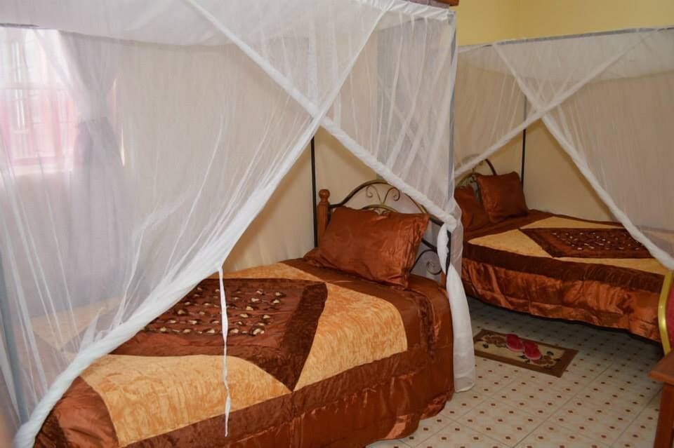Desk, blackout drapes, iron/ironing board, free cribs/infant beds