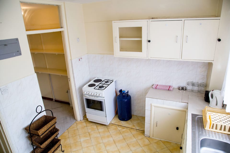 Apartment, 1 Bedroom | Private kitchen | Full-size fridge, microwave, oven, stovetop