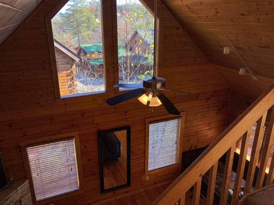 View from upstairs loft railing, toward main living area below. 