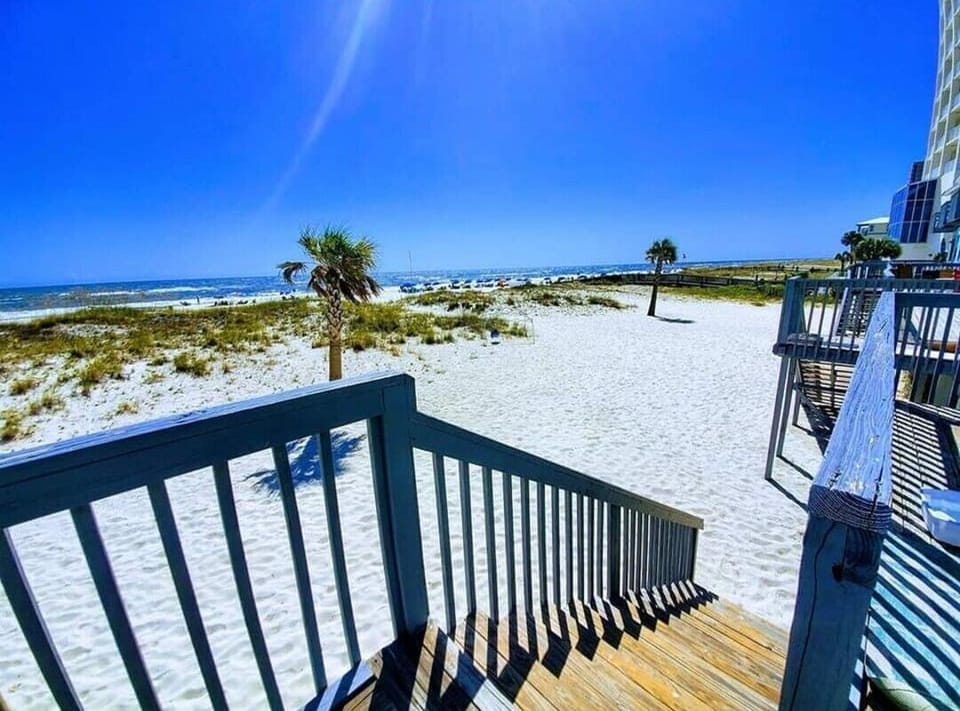 Back deck leads directly on to the white sand beach