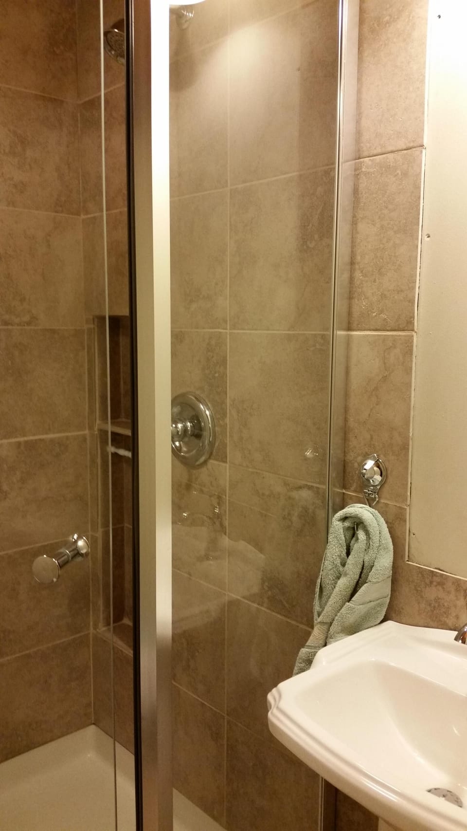 Tile shower and bathroom.