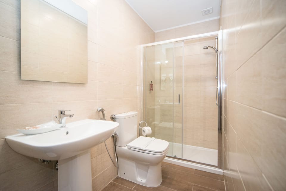 Shower, free toiletries, hair dryer, slippers
