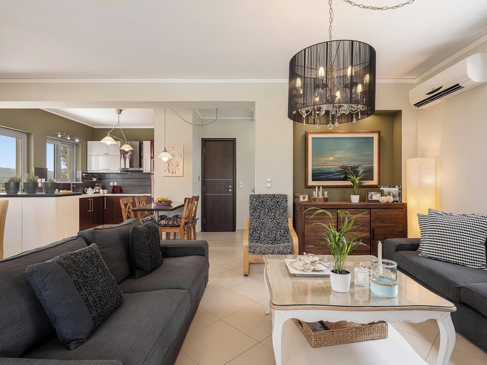 Family Villa, 3 Bedrooms, Sea View | Living area | 55-inch Smart TV with satellite channels, fireplace