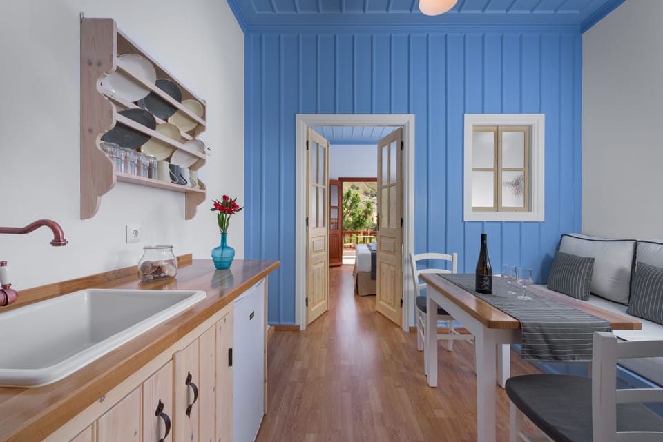 Deluxe Apartment, Balcony, Sea View | Private kitchen | Fridge, coffee/tea maker, electric kettle, highchair