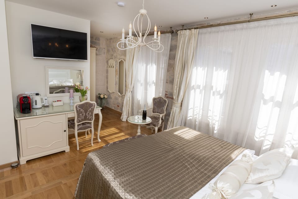 Deluxe Room, 1 King Bed | Premium bedding, minibar, in-room safe, individually decorated