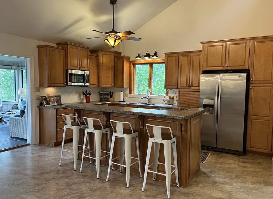 Bright, open kitchen with stainless steel appliances 