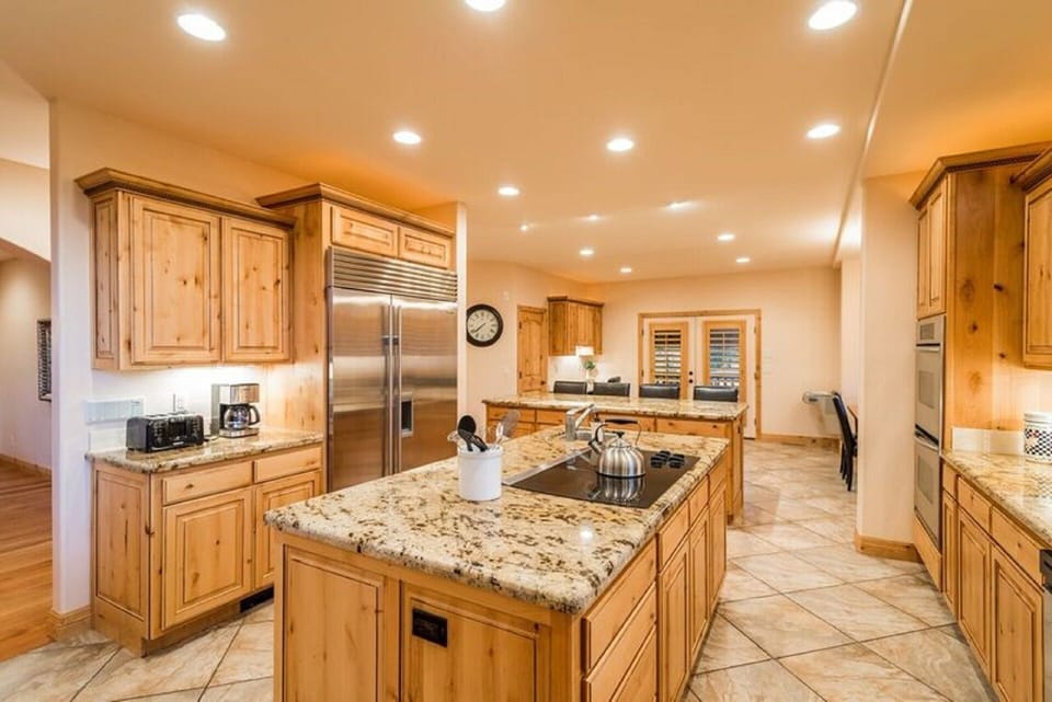 KITCHEN WITH DOUBLE OVENS, SUB-ZERO REFRIGERATOR, DOUBLE DISHWASHERS AND MORE.