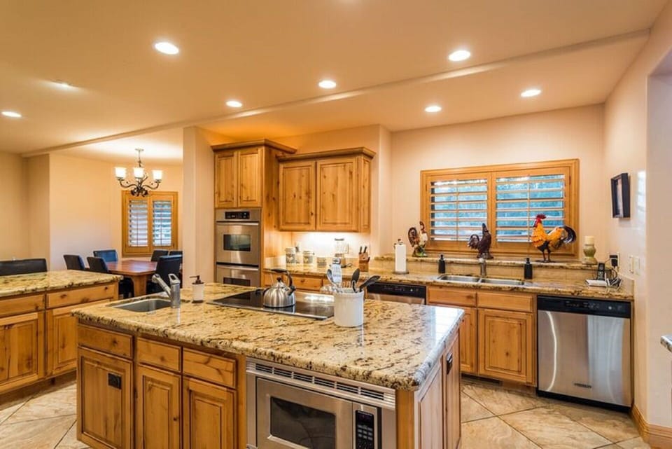 ANOTHER VIEW OF THE KITCHEN, WHICH CONTAINS EVERYTHING TO CREATE A GOURMET MEAL.