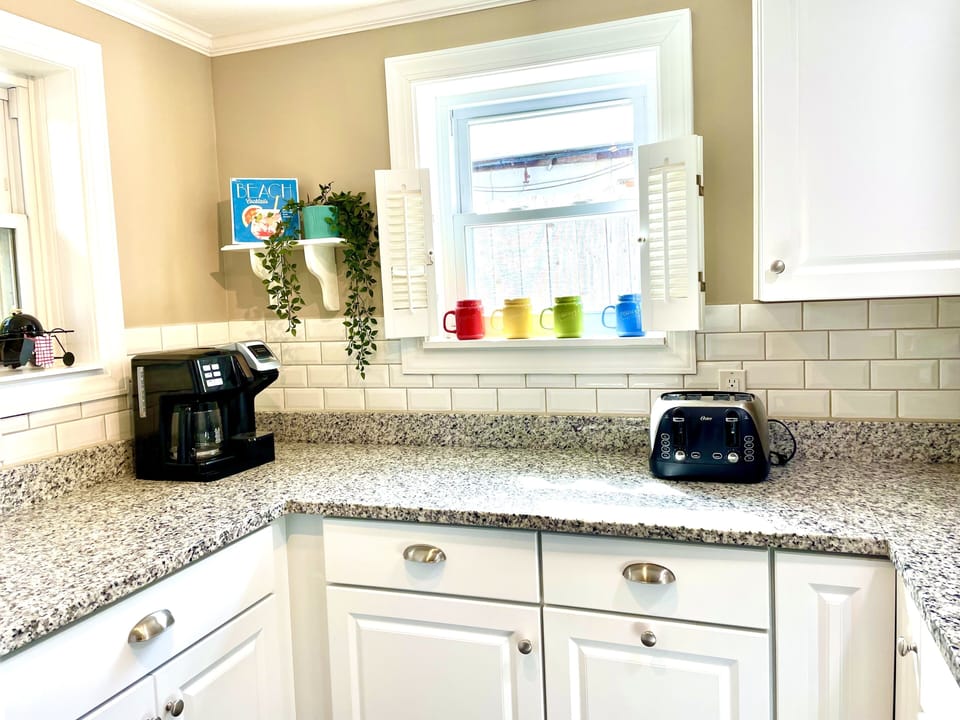 Kitchen includes coffee maker and toaster
