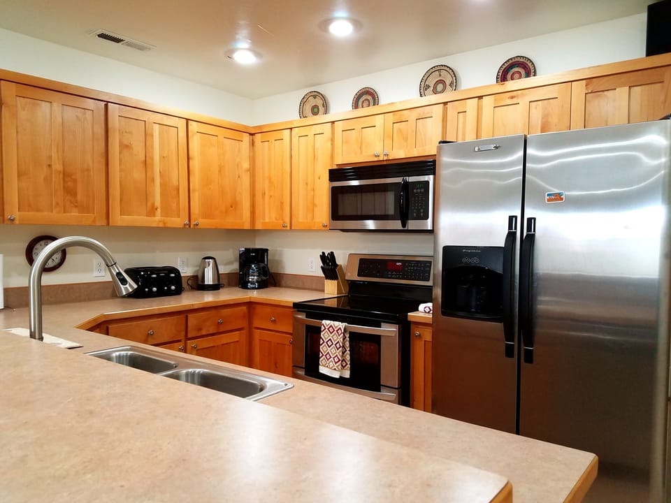 Kitchen has service for 16. Spices, sugar, and flour help make you at home.