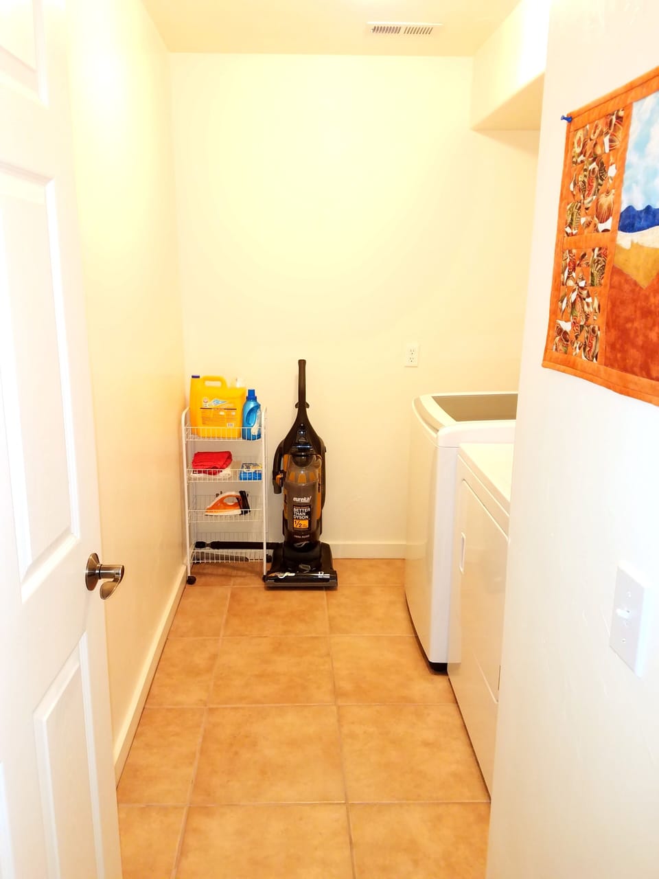 Laundry Room with washer and dryer and detergent.