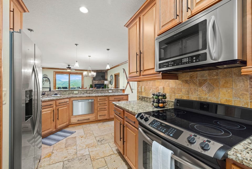 Kitchen view open to dining and living areas