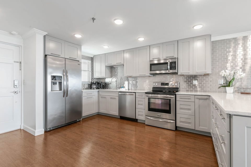 The kitchen is bright, modern, and cheerful.