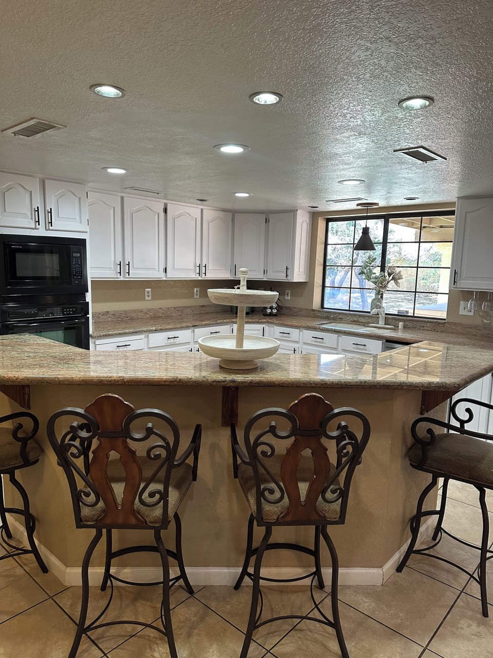 Kitchen island welcome you to sit down and enjoy! 