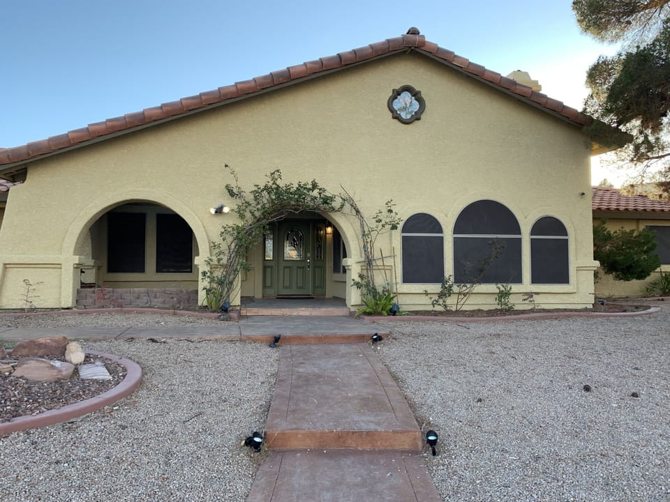 Home on cul de sac welcoming entrance.