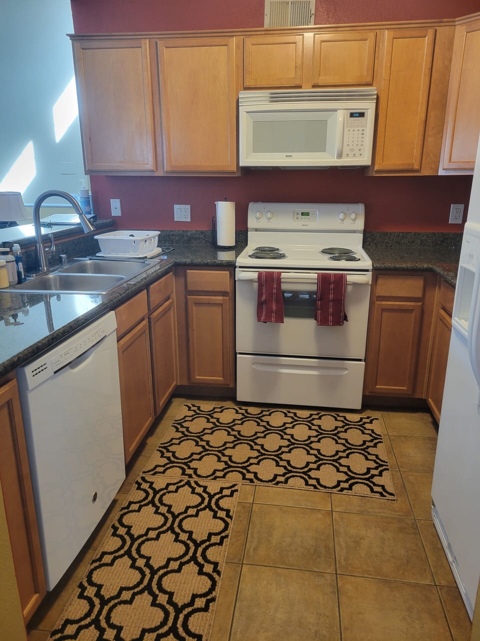 Fully stocked kitchen with all dishes, utensils, cookware and bakeware.
