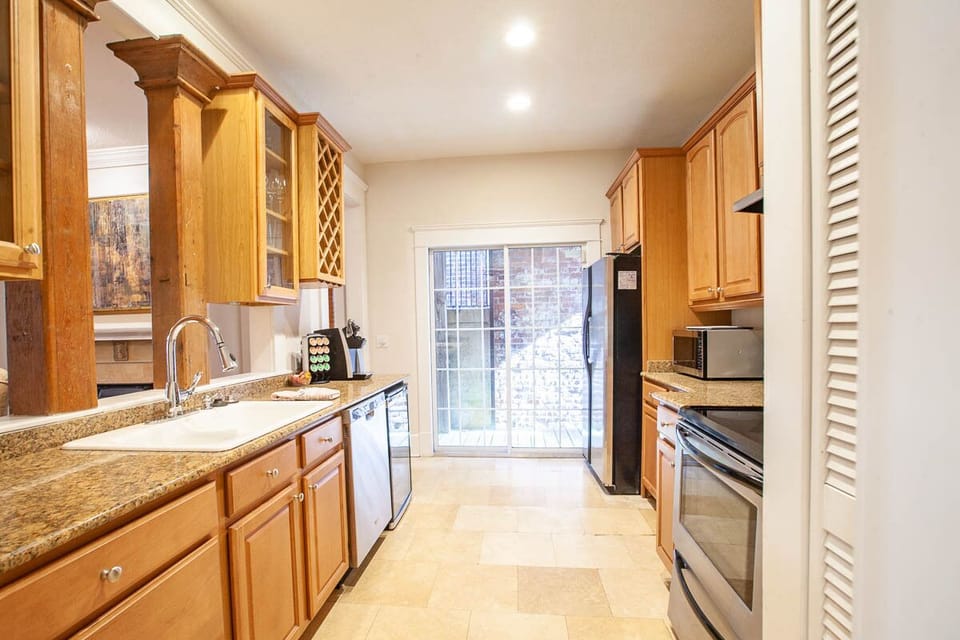 Updated kitchen with granite counter-tops and stainless appliances 