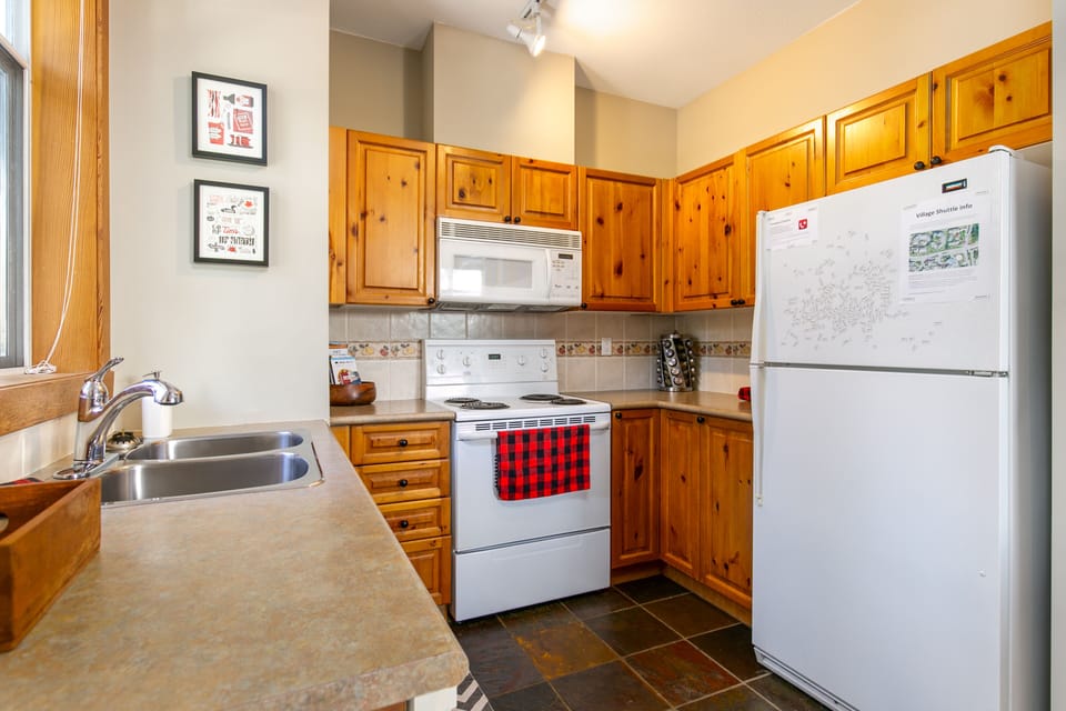 Well appointed kitchen with cooking essentials and coffee machine