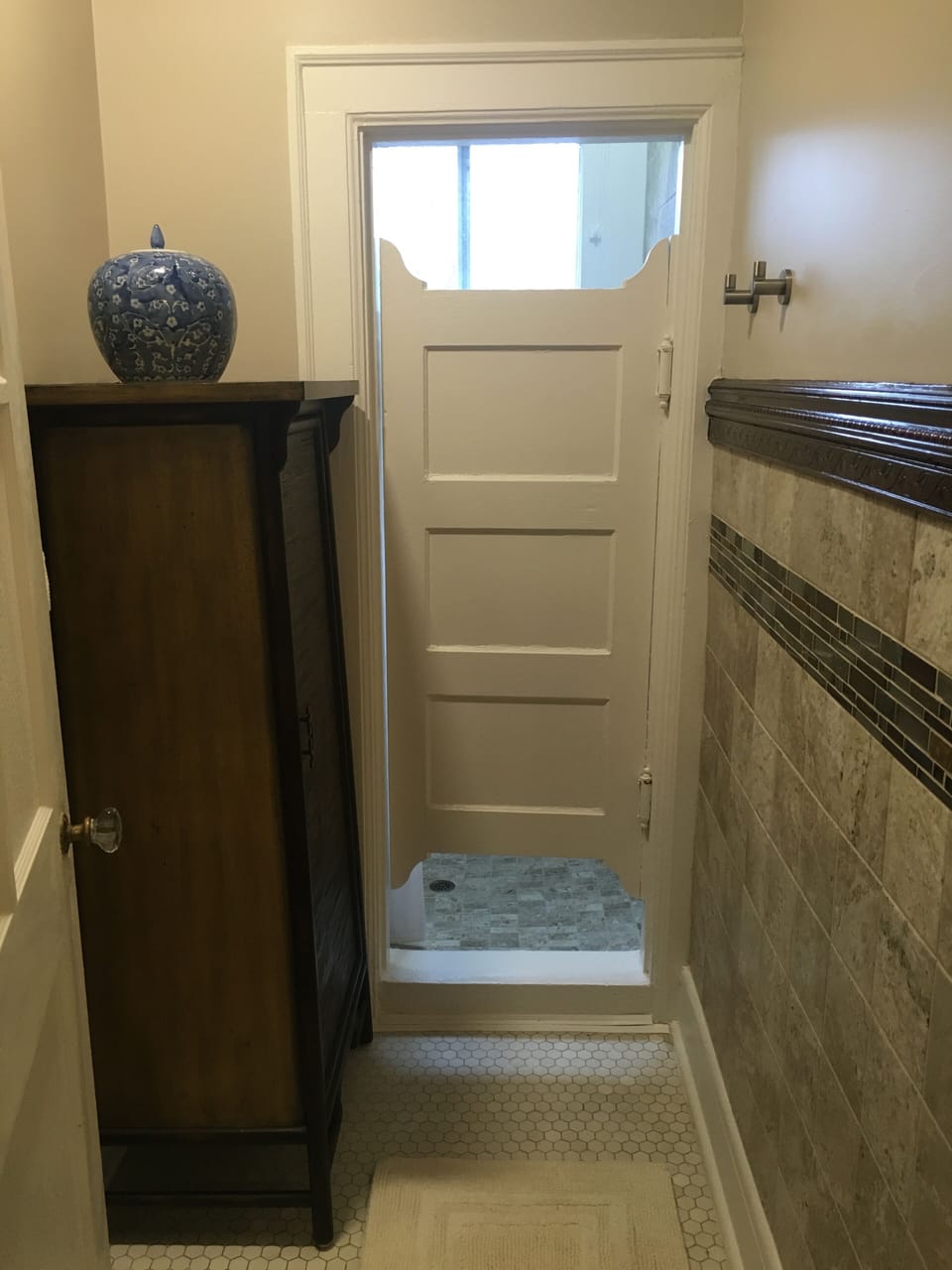 Private & gorgeous original shower room with custom tile work.