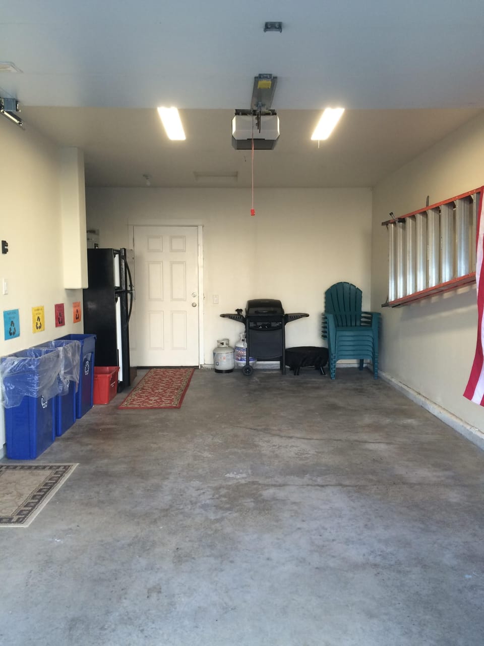 The garage can fit one standard size vehicle, bins for recycling.