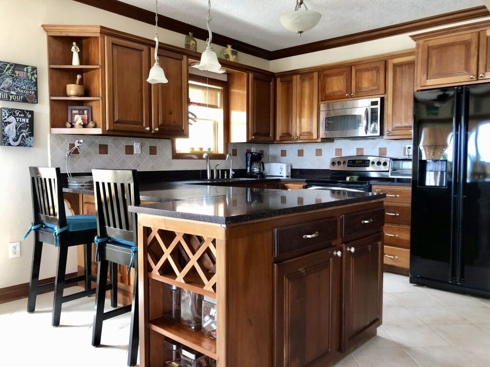 Very well stocked kitchen with small appliances and other necessary untincils
