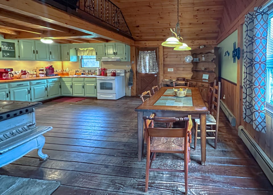 Savor your meals in our welcoming dining area with open-plan kitchen views.