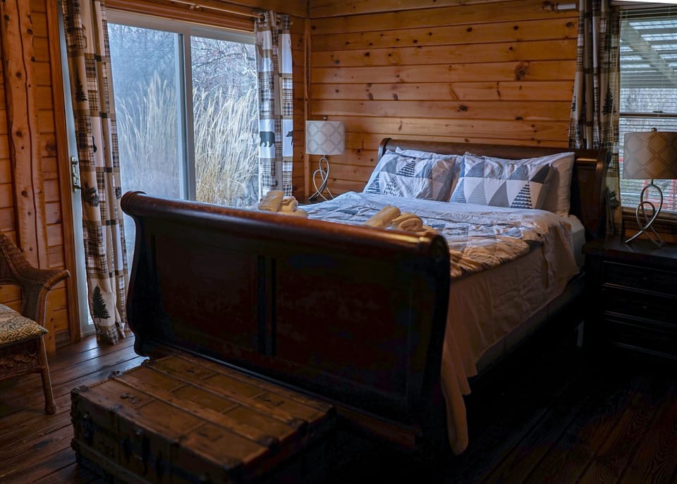 Dream away in a serene bedroom with picturesque nature views.