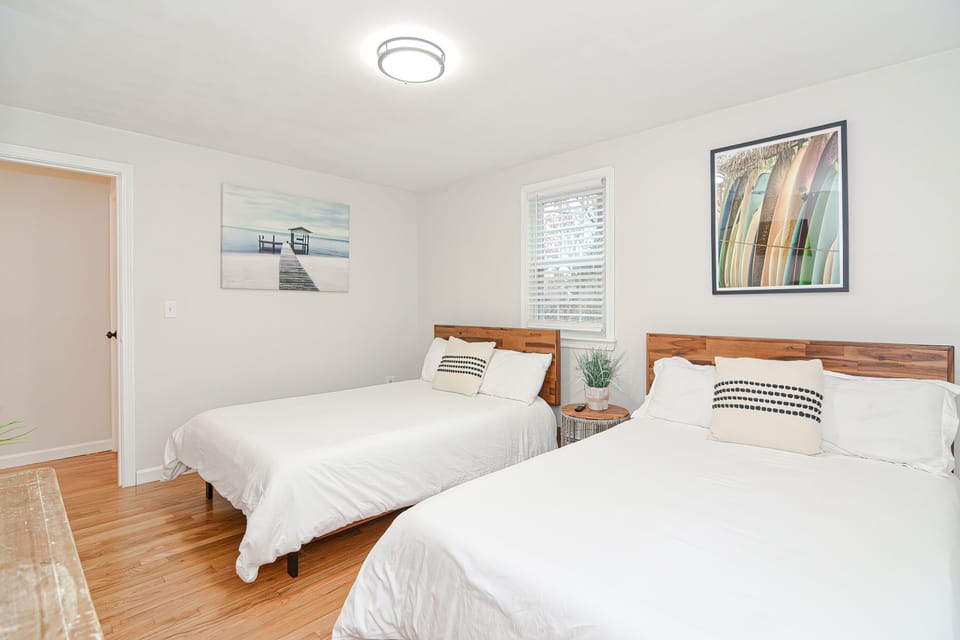 Twin Retreat — Two beds and bright windows, made for easy mornings.