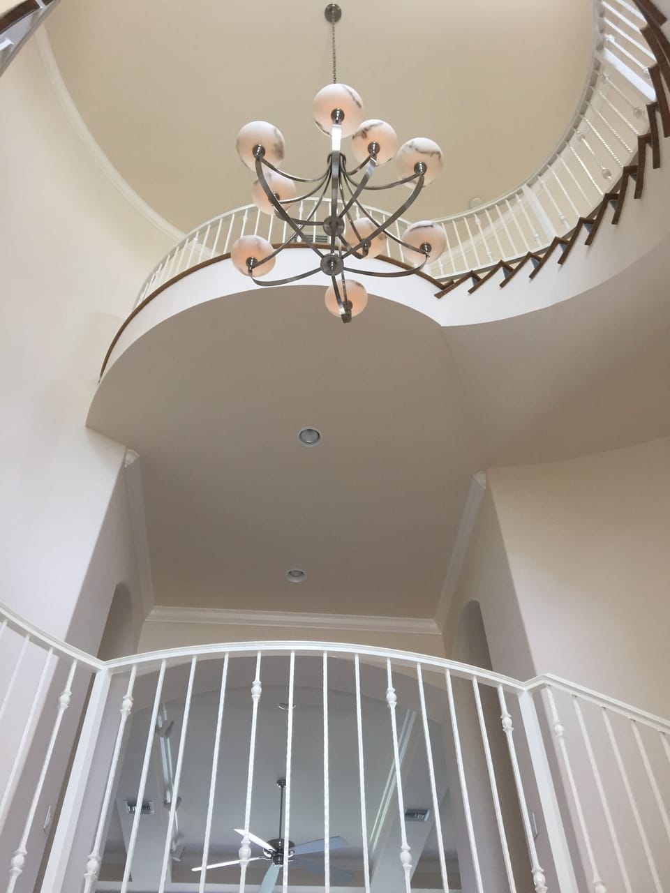 sprial staircase leading to top level main bedroom