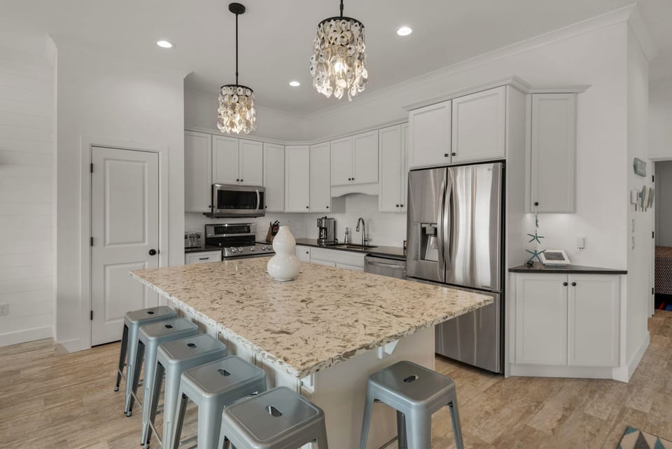 Kitchen with 6 seat island. Kitchen equipped with whatever you need. 