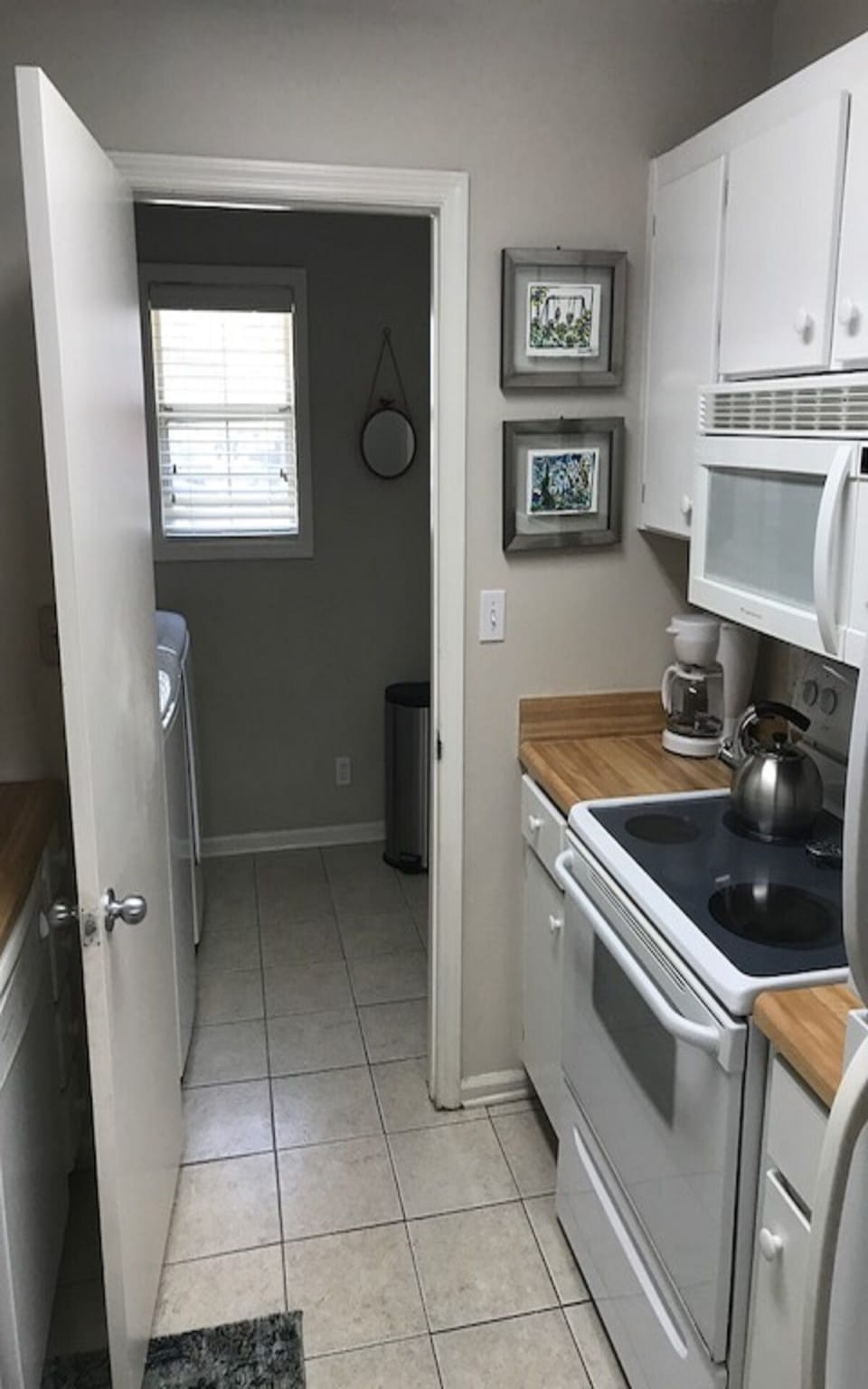 KITCHEN INTO HALL WITH WASHER AND DRYER