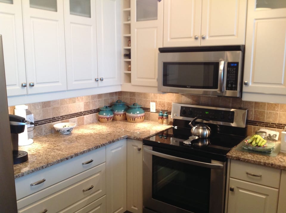 Kitchen with kettle, coffee maker, even cookie jar