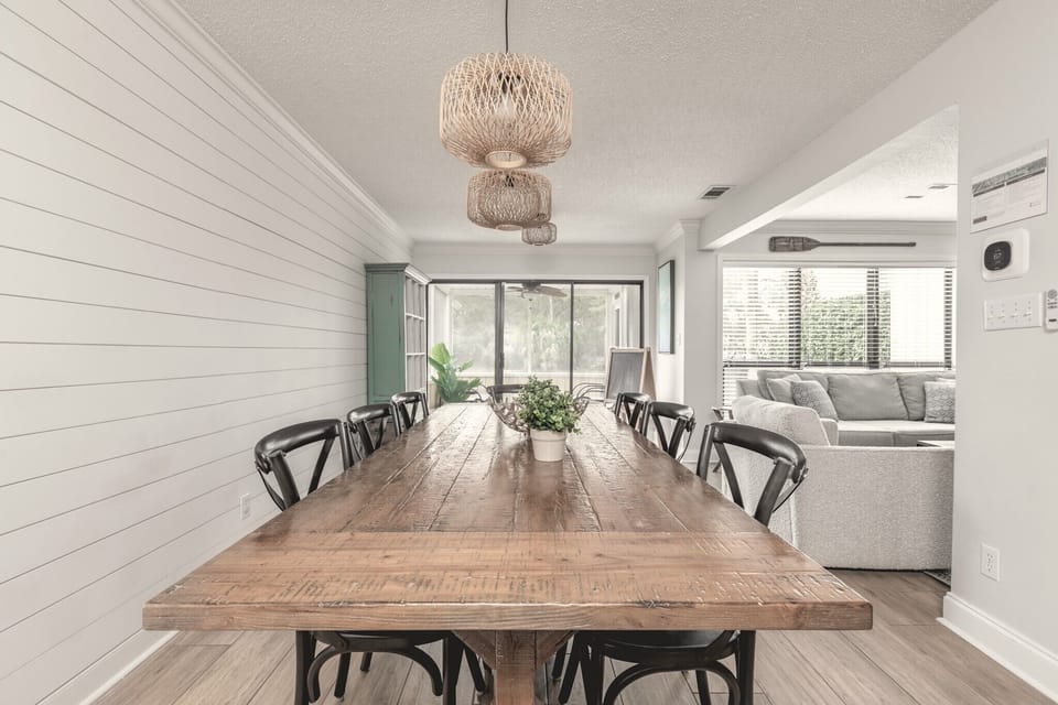 Dining room with attached playroom overlooking the back patio and pond!
