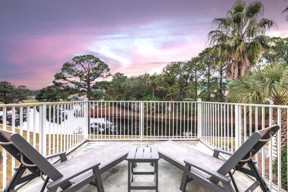 Private balcony off the master bedroom overlooking the pond. 