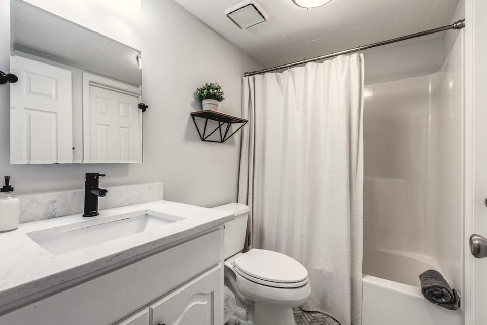 First floor full bathroom with tub/shower combo. 