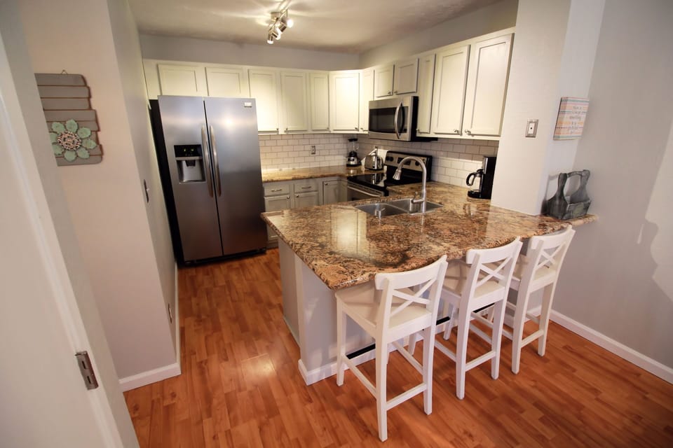Kitchen with stainless steel appliances.